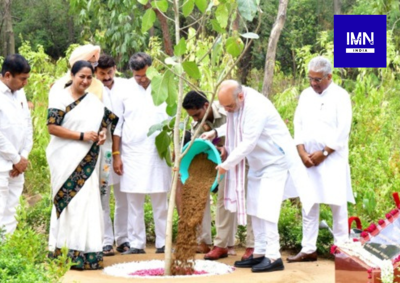 Union Home Minister Amit Shah plants a sapling during the Ek Ped Maa Ke Naam plantation campaign in Delhi.