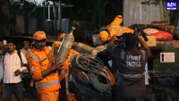 Rescue teams work at the site of the Sikkim tunnel collapse near Samardung, Namchi district